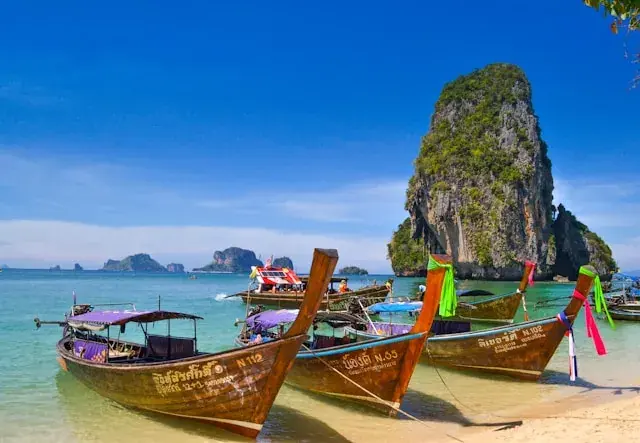 Limestone cliffs and longtail boats in Krabi