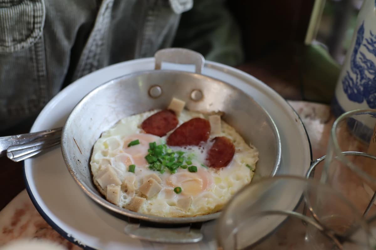 Kai krata, pan-fried eggs with Chinese sausage and pork, at Samantao heritage coffee house in Bangkok