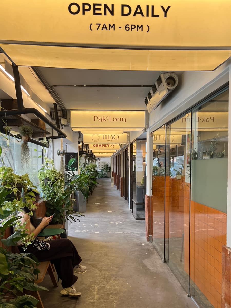 Small independent shops and greenery in the Tur Gub Chan community mall