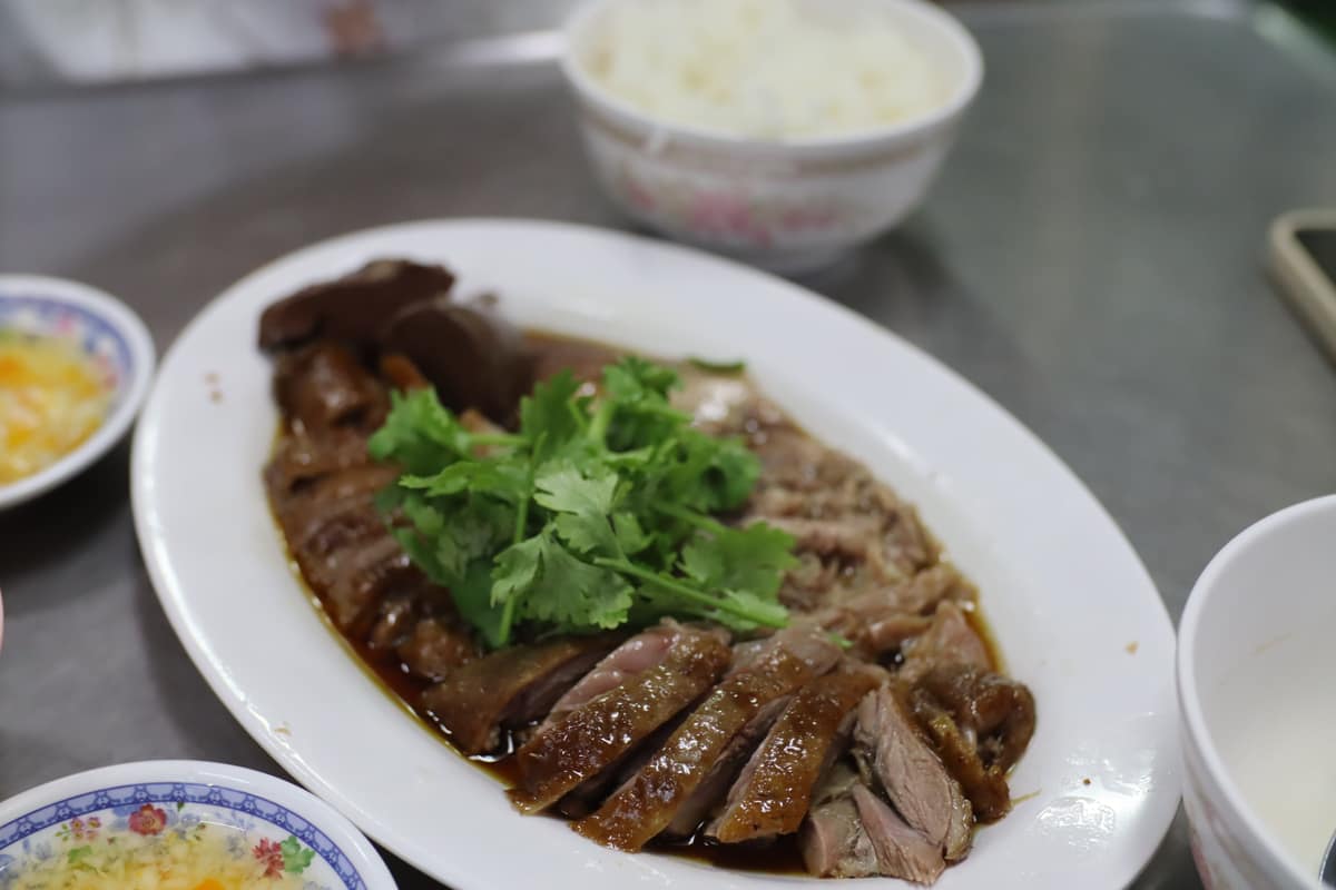 A plate of sliced Teochew braised goose with coriander and rice at Urai Han Palo