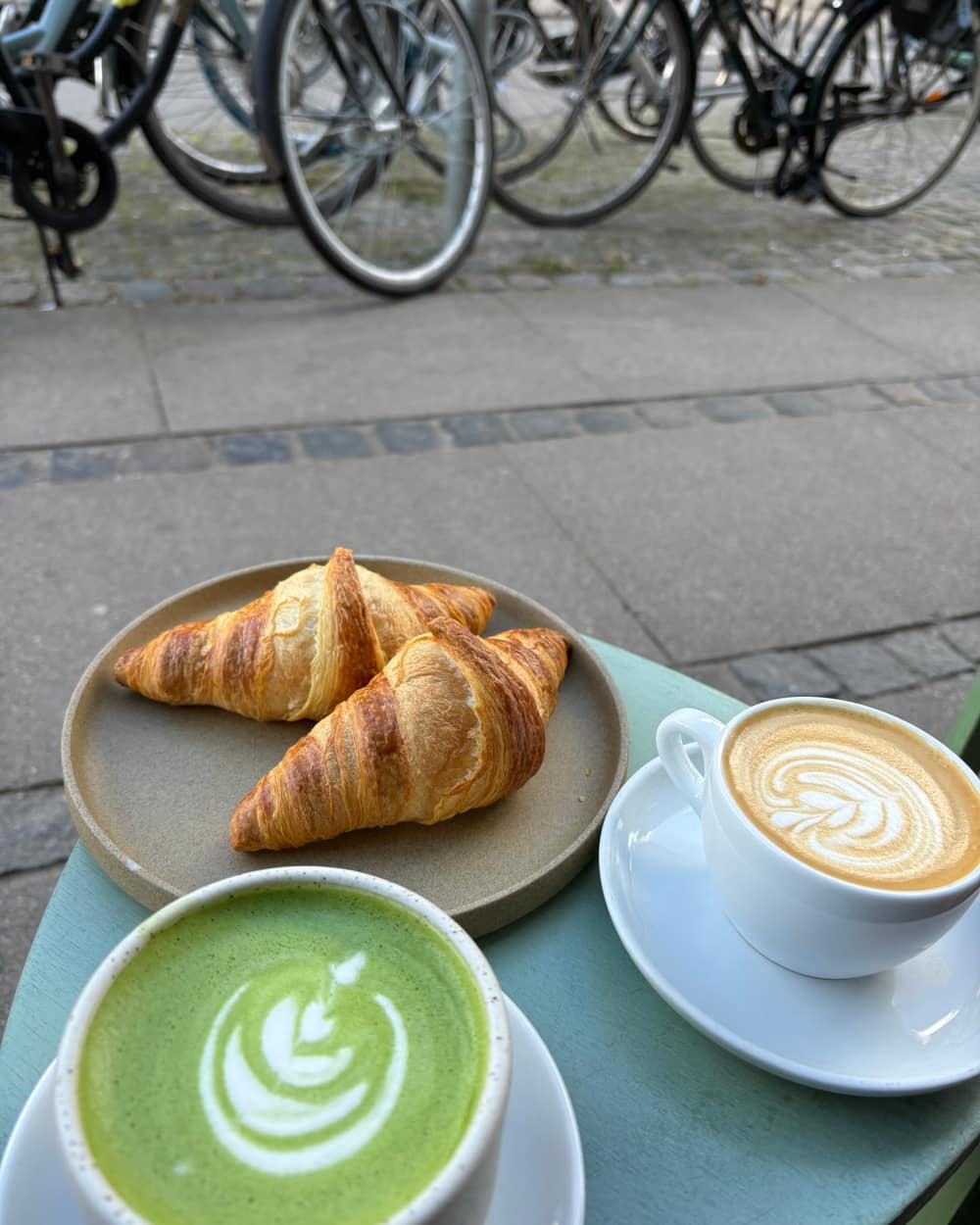 Croissants, a cappuccino and a matcha latte at a Copenhagen cafe